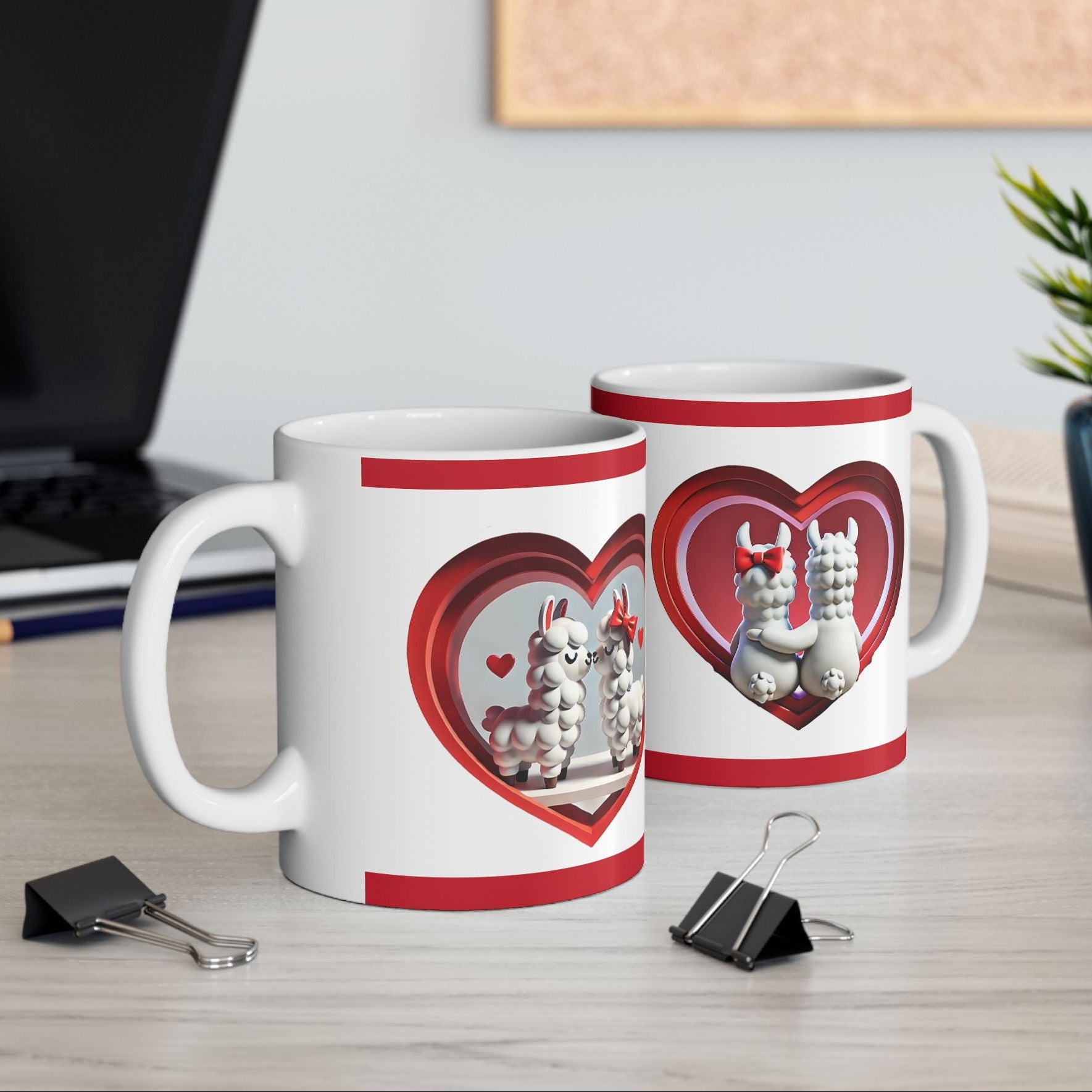 Two mugs with heart designs featuring cartoon llamas